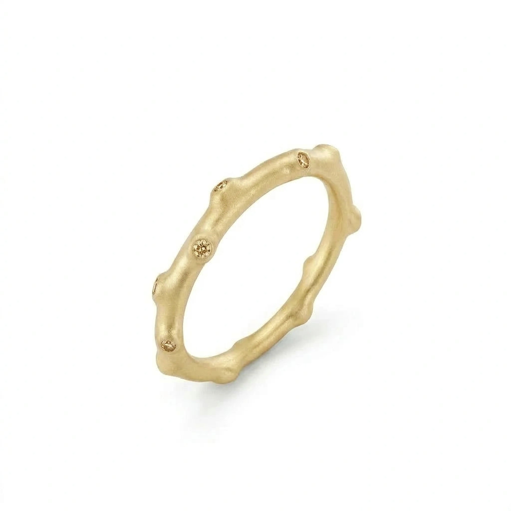 Champagne diamond bamboo ring in 14K brown gold, angled view showing matte satin finish and champagne diamond nodes — Black Pearl of Queens
