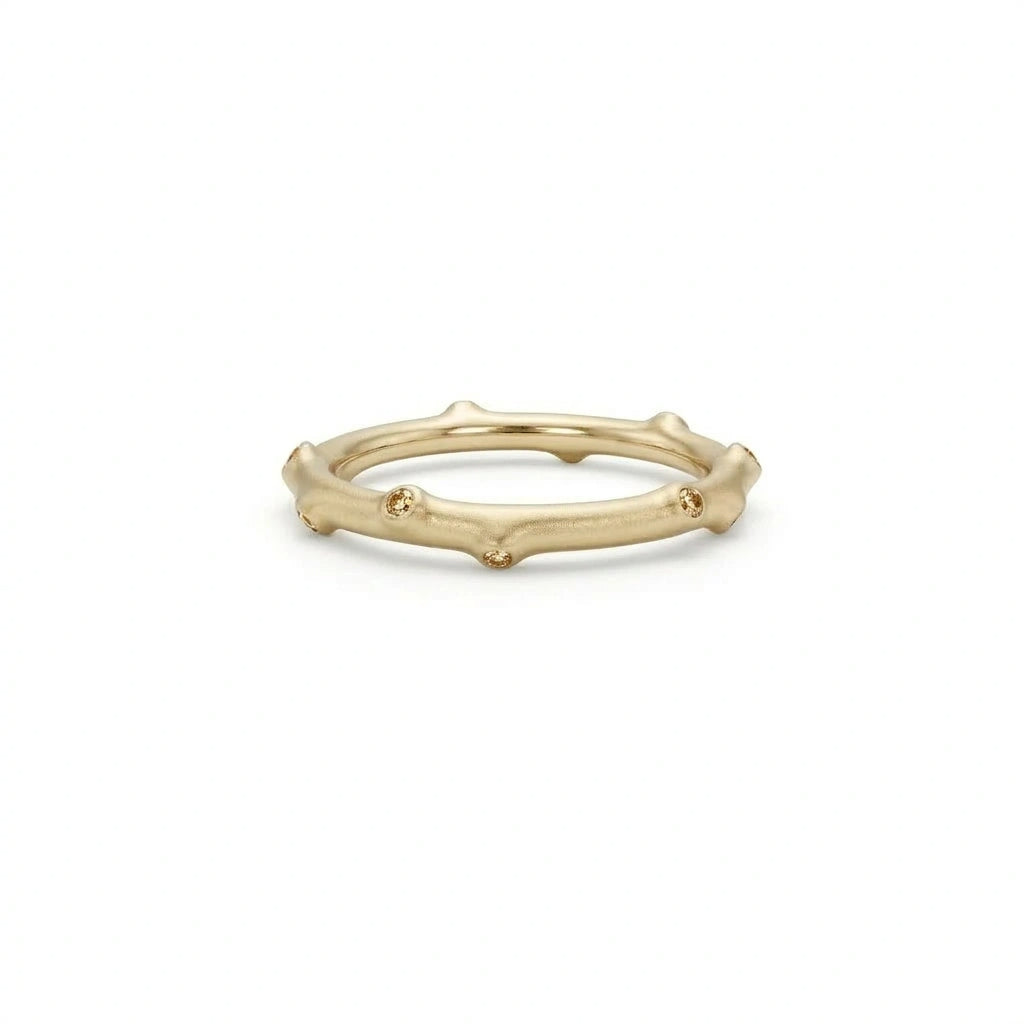 Champagne diamond bamboo ring in 14K brown gold shown on hand in four lifestyle settings — Black Pearl of Queens