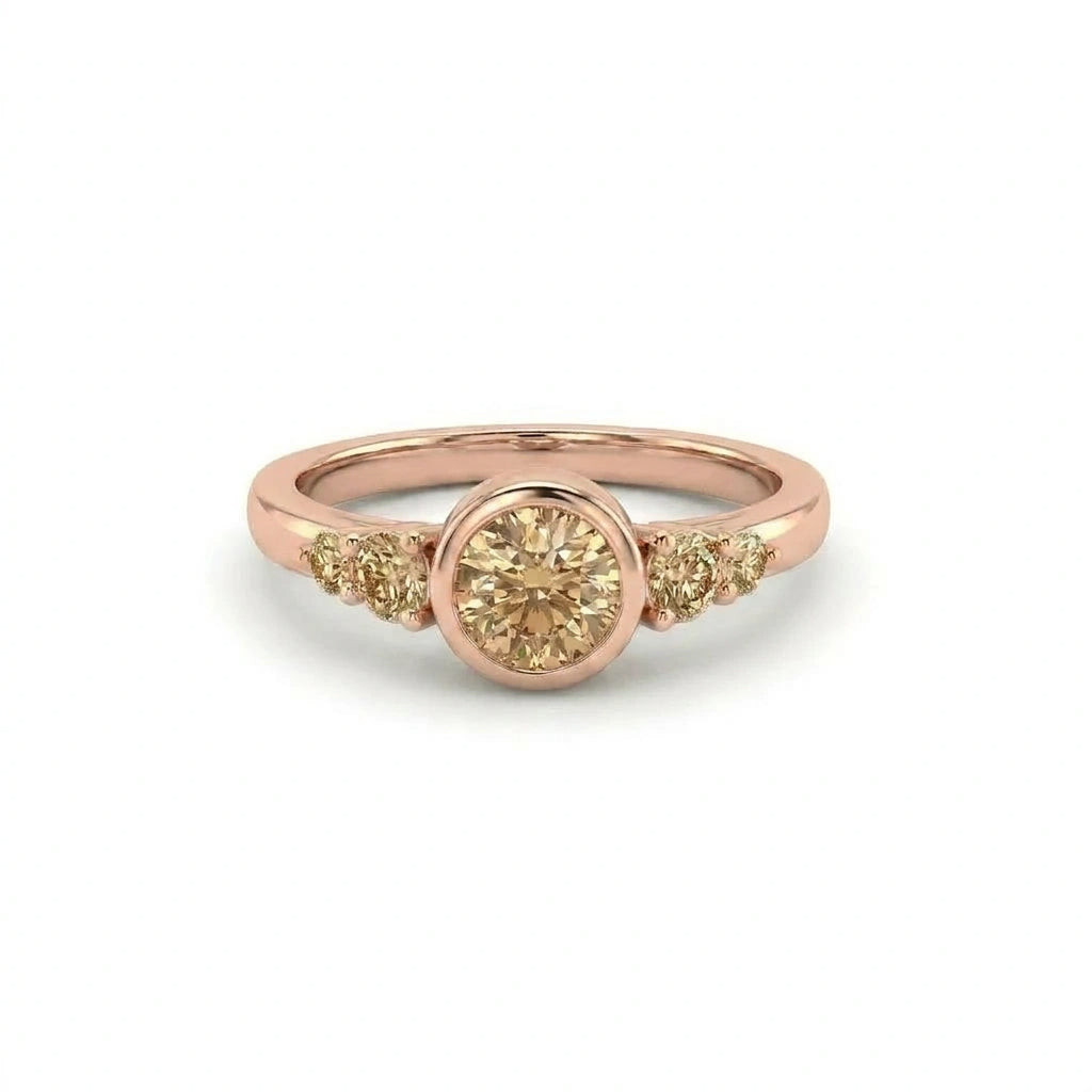 Natural champagne diamond bezel engagement ring in 14K rose gold with graduated accent stones