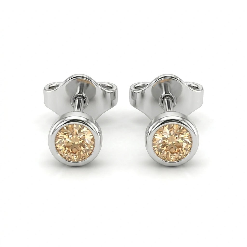 Natural champagne diamond bezel stud earrings in 14K white gold — pair product view on white background