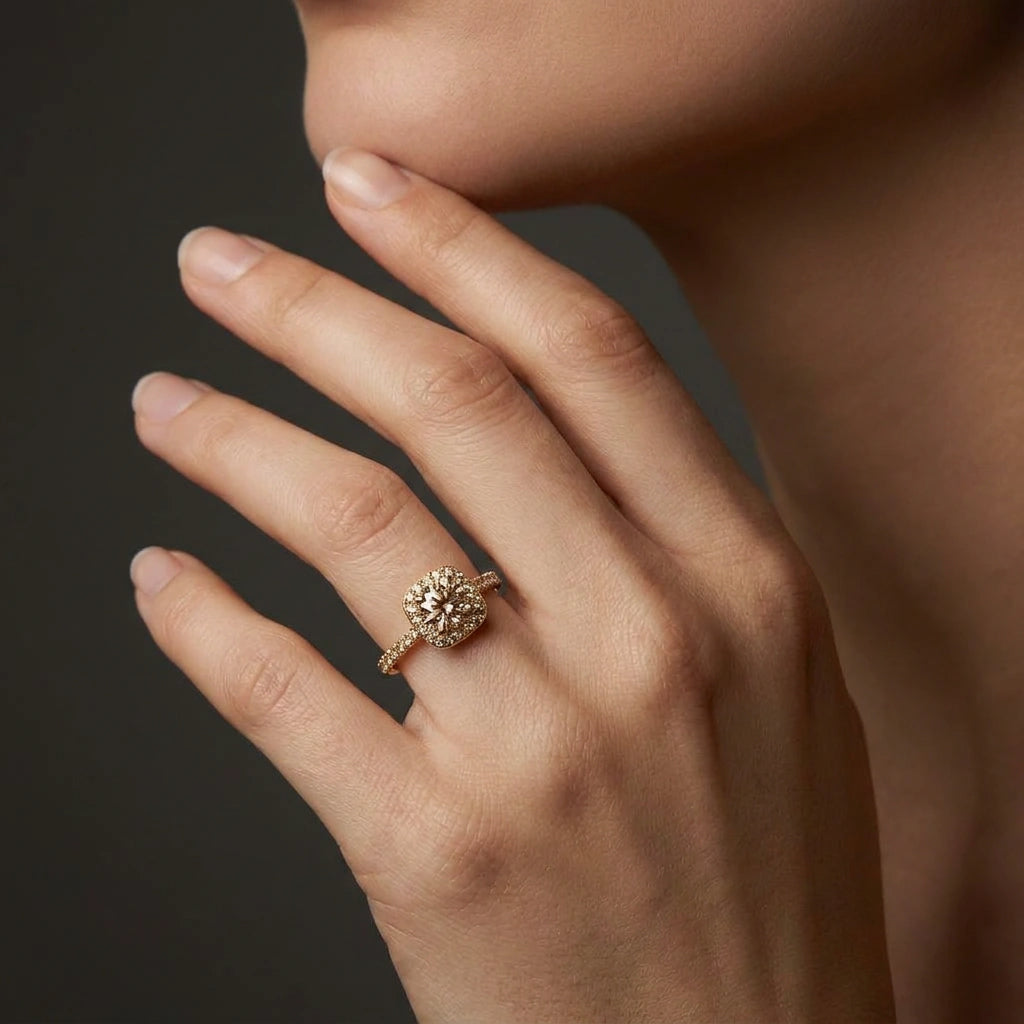 Natural champagne diamond halo engagement ring on hand, warm champagne stones close-up