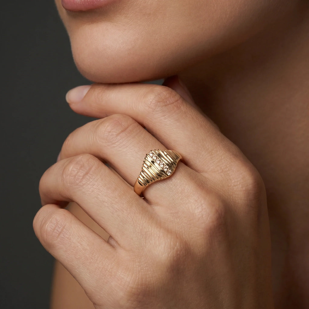 Champagne diamond ribbed signet ring in 14K yellow gold worn on hand, close-up lifestyle shot