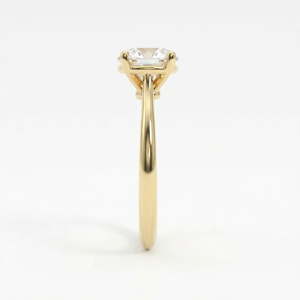 1.5ct classic round diamond solitaire engagement ring in 14K yellow gold - four-prong setting detail