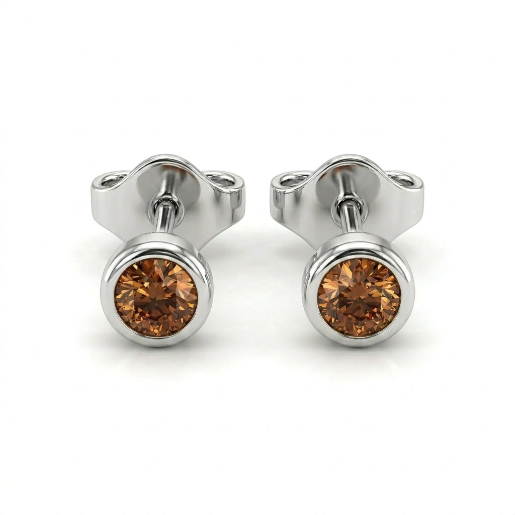 Natural cognac diamond bezel stud earrings in 14K white gold — pair product view on white background