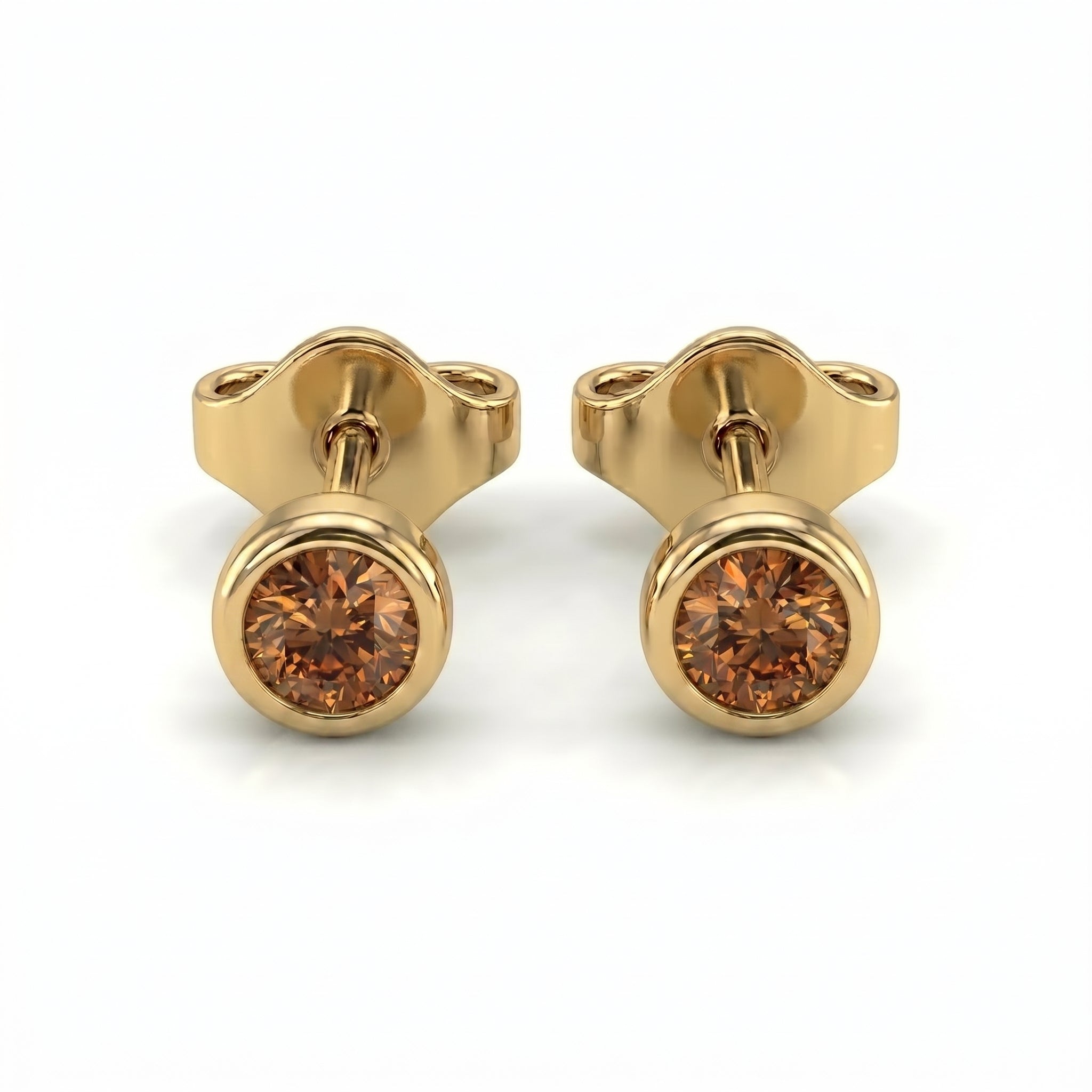 Natural cognac diamond bezel stud earrings in 14K yellow gold — pair product view on white background