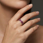 Crimson Eternity double row ruby ring worn on hand in solid 14K gold with pavé red gemstones