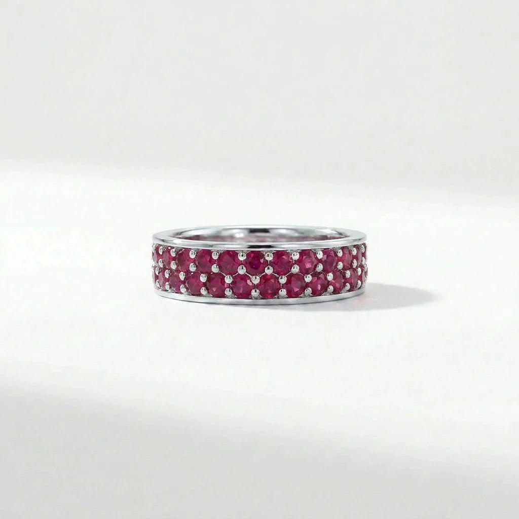 Double row ruby eternity band in 14K white gold with pavé set red gemstones