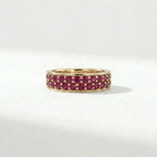 Double row ruby eternity ring in 14K yellow gold with full pavé gemstone setting