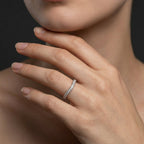 Curved diamond wedding band worn on the hand, 14K white gold contour band nesting on the finger
