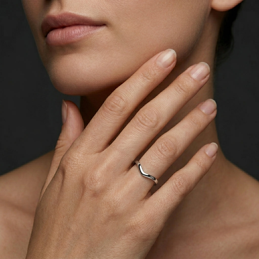 Plain curved wedding band worn on the hand, high-polish contour nesting band in 14K white gold