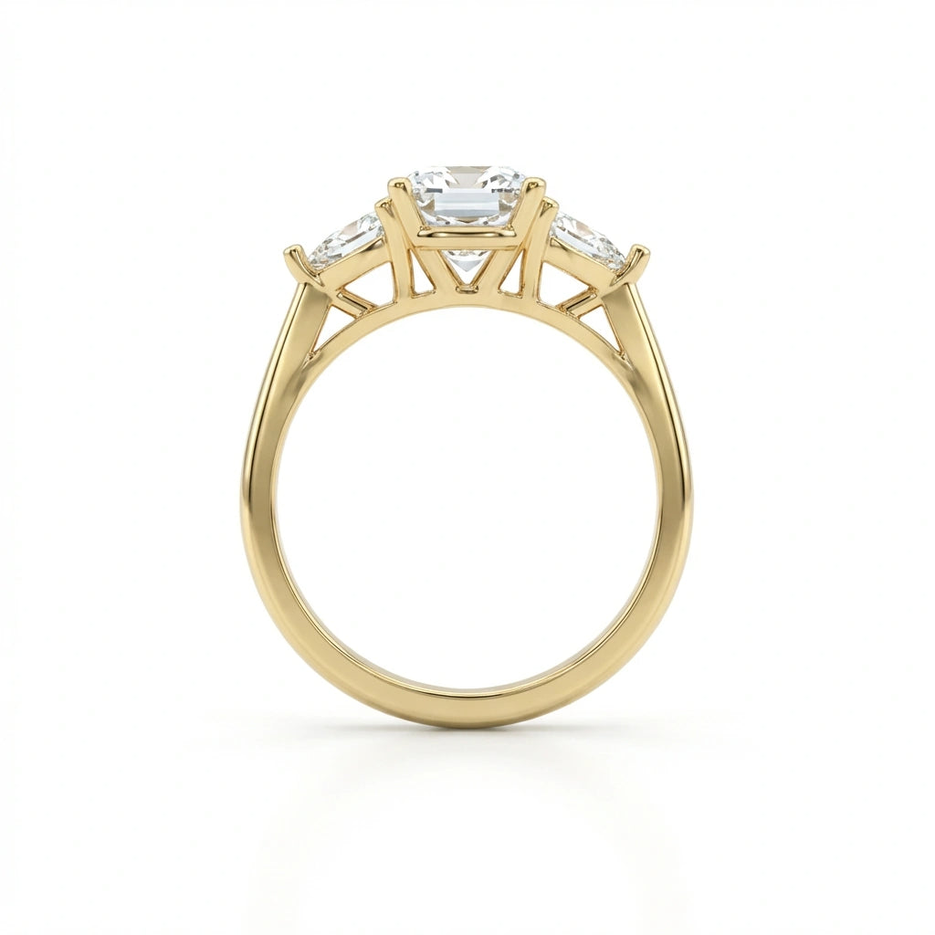 Side profile of the cushion three-stone engagement ring in 14K yellow gold, showing the low setting height