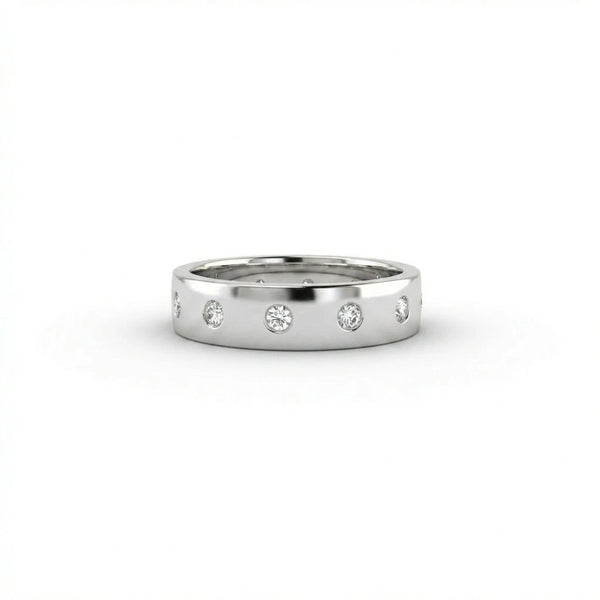 Cyrus Diamond Station Band in 14K white gold, front view on white background showing wide domed band with 12 flush bezel-set D-F colorless lab diamonds in scattered station arrangement
