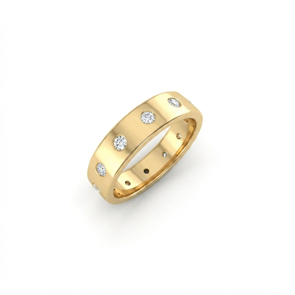 Cyrus Diamond Station Band in 14K yellow gold, angled three-quarter view showing wide dome profile and scattered flush bezel-set D-F lab diamonds around full circumference of band