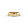 Cyrus Diamond Station Band in 14K yellow gold, front view on white background showing wide domed band with 12 flush bezel-set D-F colorless lab diamonds in scattered station arrangement