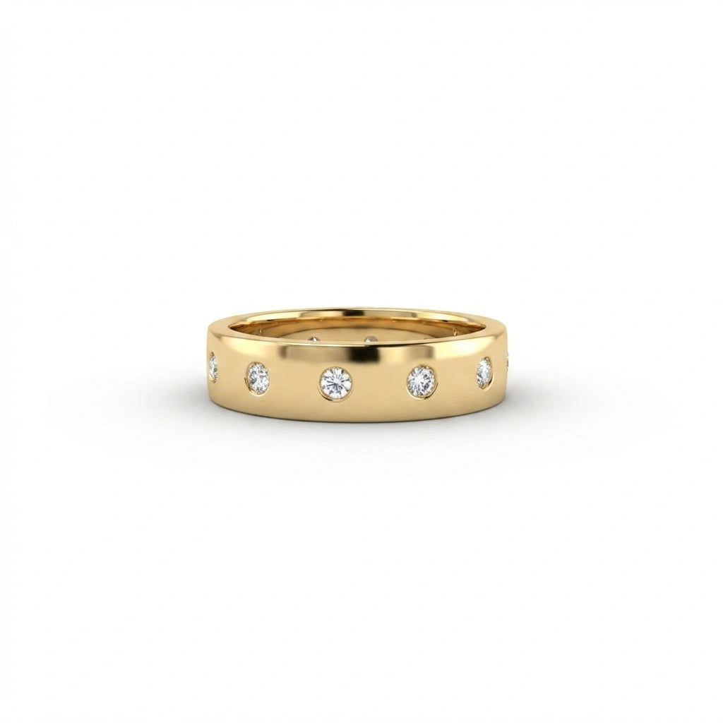 Cyrus Diamond Station Band in 14K yellow gold, front view on white background showing wide domed band with 12 flush bezel-set D-F colorless lab diamonds in scattered station arrangement