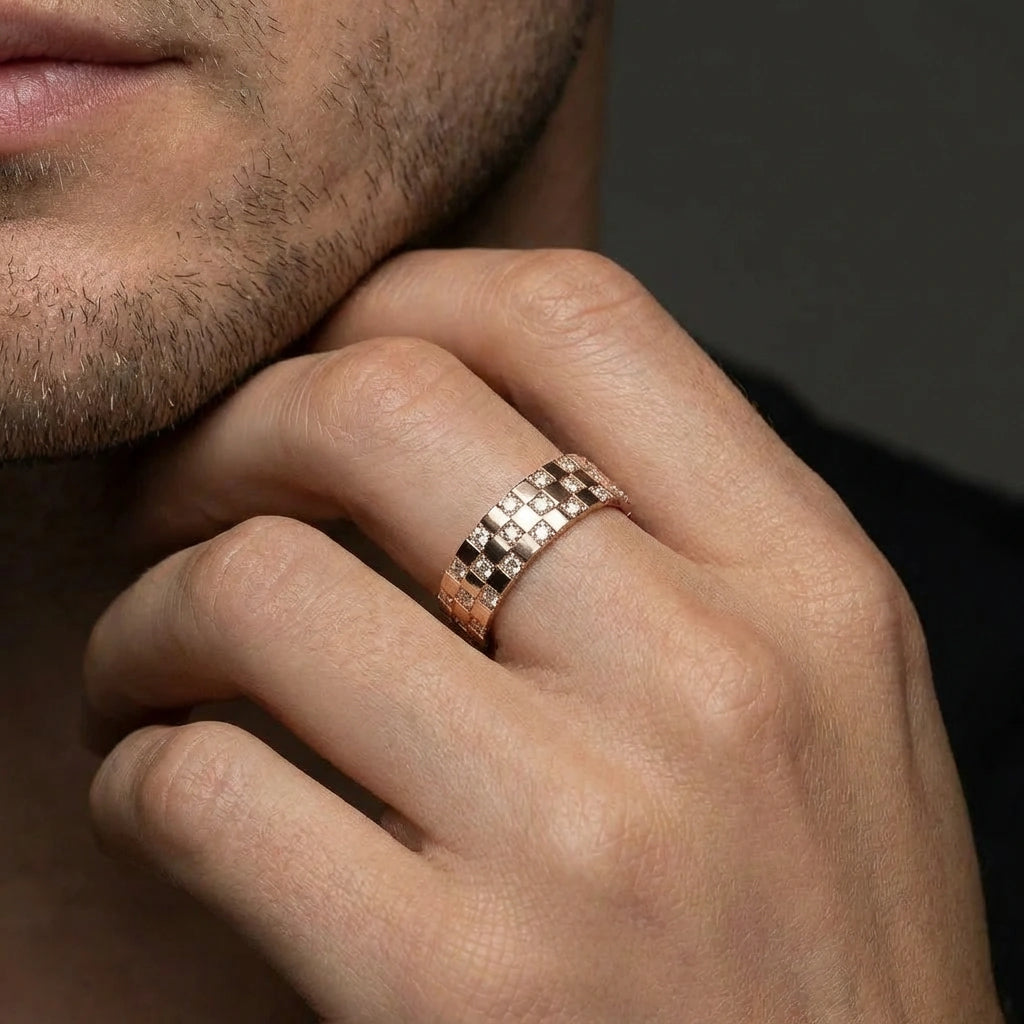 Cyrus Tessera diamond band on male hand in 14K rose gold with modern geometric tile design and flush set round diamonds