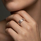 Cyrus Tessera diamond band worn on hand in 14K rose gold featuring mosaic square pattern with flush set diamonds