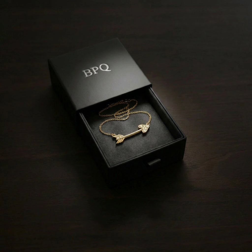 14K solid gold diamond arrow necklace presented in Black Pearl of Queens luxury matte black jewelry box