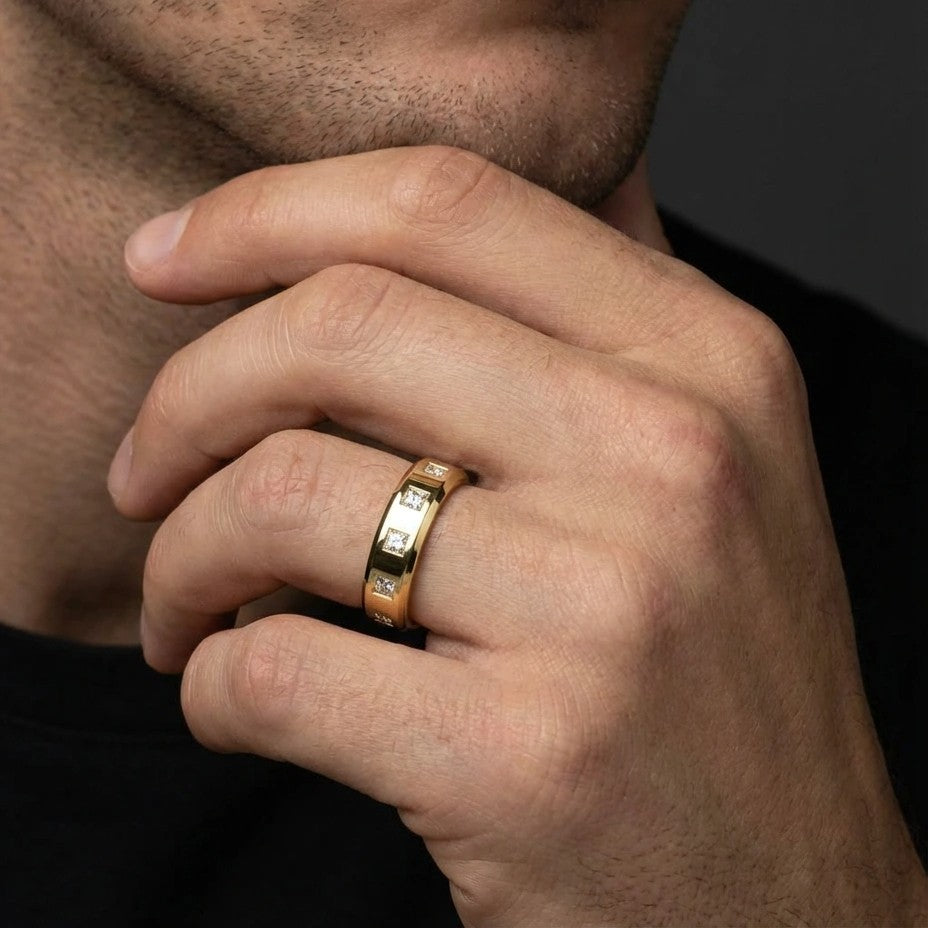 Male model wearing Draven Square Diamond Band in 14K yellow gold, close-up editorial shot showing flush-set princess cut diamonds on finger