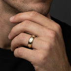 Male model wearing Draven Square Diamond Band in 14K yellow gold, close-up editorial shot showing flush-set princess cut diamonds on finger
