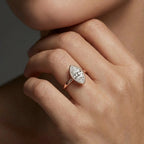 Solid 14K rose gold marquise cut diamond ring with bezel set center stone and sleek band