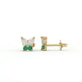 Pair of butterfly stud earrings with marquise diamonds and emerald gemstones in solid yellow gold, front and side profile view.