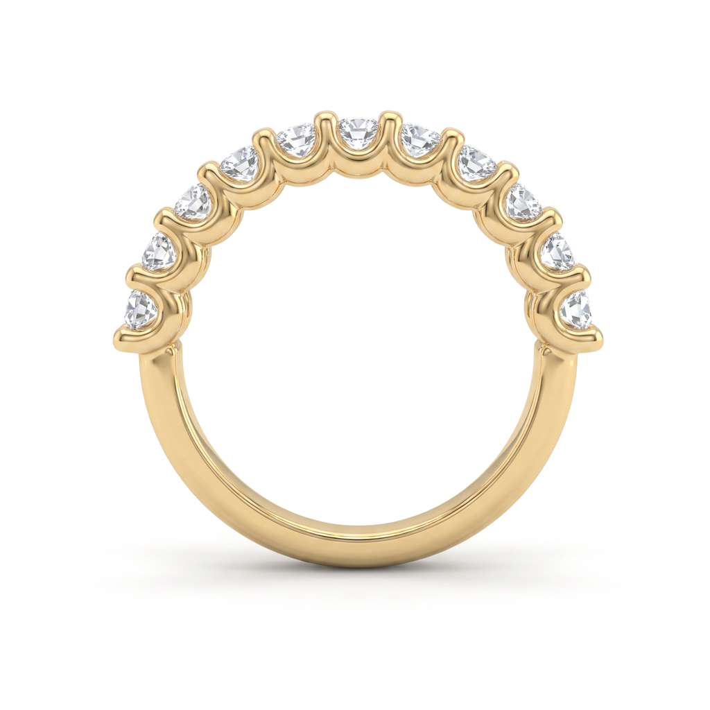 Side profile of the emerald cut diamond wedding band in 14K yellow gold, showing the shared prongs and how low the stones sit against the finger