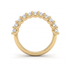 Side profile of the emerald cut diamond wedding band in 14K yellow gold, showing the shared prongs and how low the stones sit against the finger