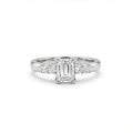 Emerald cut five-stone engagement ring in 14K white gold, front view with four graduated round side stones