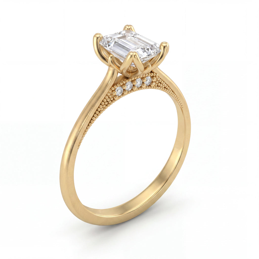 Emerald cut lotus prong milgrain Lab-Grown Diamond engagement ring in 14K yellow gold, angled view showing lotus petal prong basket — Black Pearl of Queens