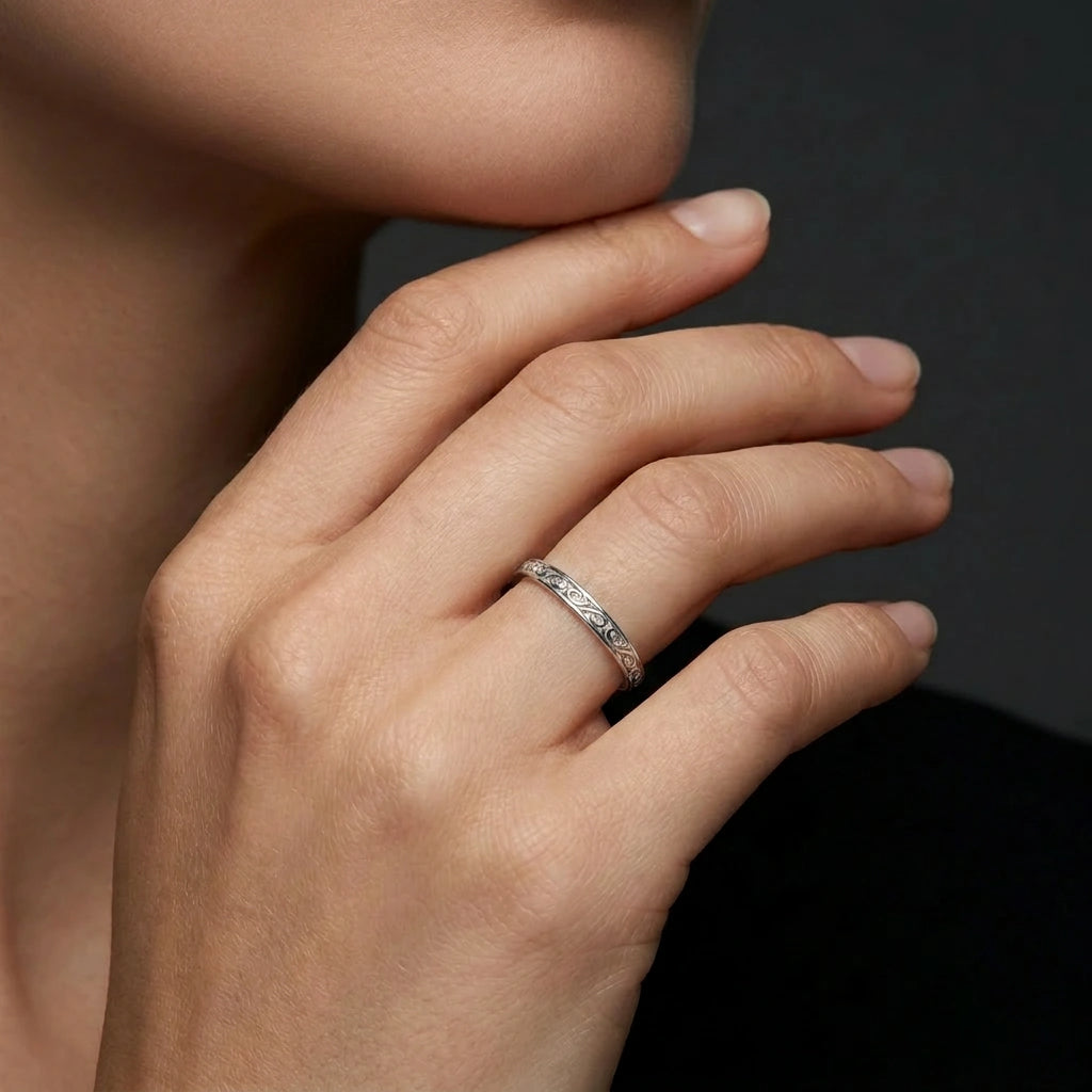 Woman wearing a 3mm filigree scroll wedding band in 14K white gold — Black Pearl of Queens