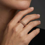 Gold basket weave wedding band in 14K brown gold worn on a woman’s hand — Black Pearl of Queens
