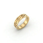 Angled view of Greek key meander wedding band in solid 14K yellow gold showing full ring depth and pattern detail