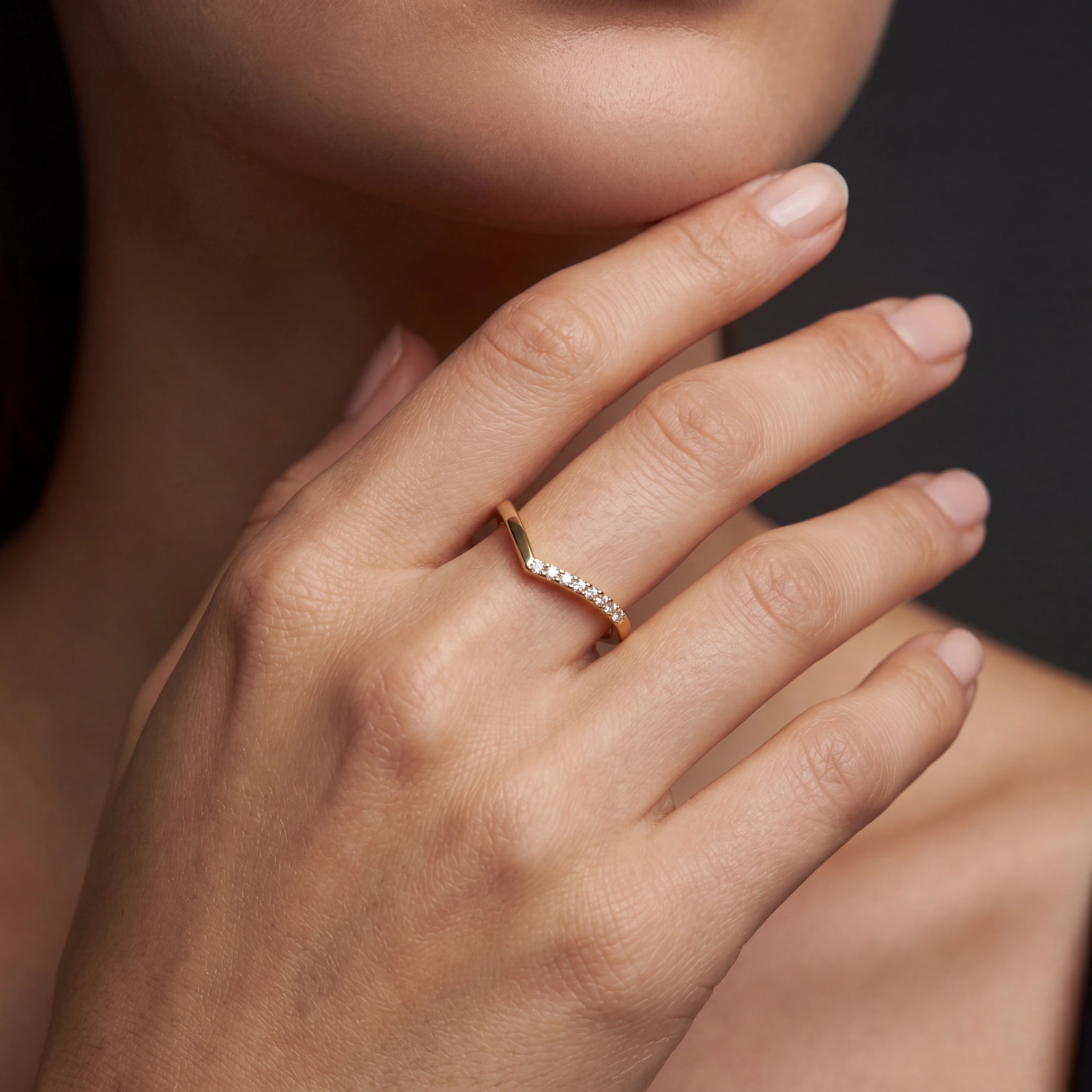 Model wearing half pavé wishbone Lab-Grown Diamond ring in 14K rose gold, close-up — Black Pearl of Queens