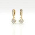 Helion diamond starburst hoop earrings in 14k yellow gold with pavé diamonds and sunburst charm