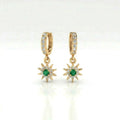 Helion emerald starburst hoop earrings in 14k yellow gold with emerald center and pavé diamond starburst charm