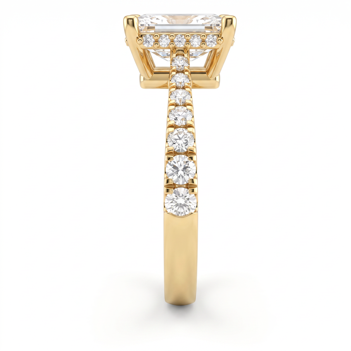 Close-up of the hidden halo and pavé shoulders on a 14K yellow gold Emerald Cut Lab-Grown Diamond engagement ring