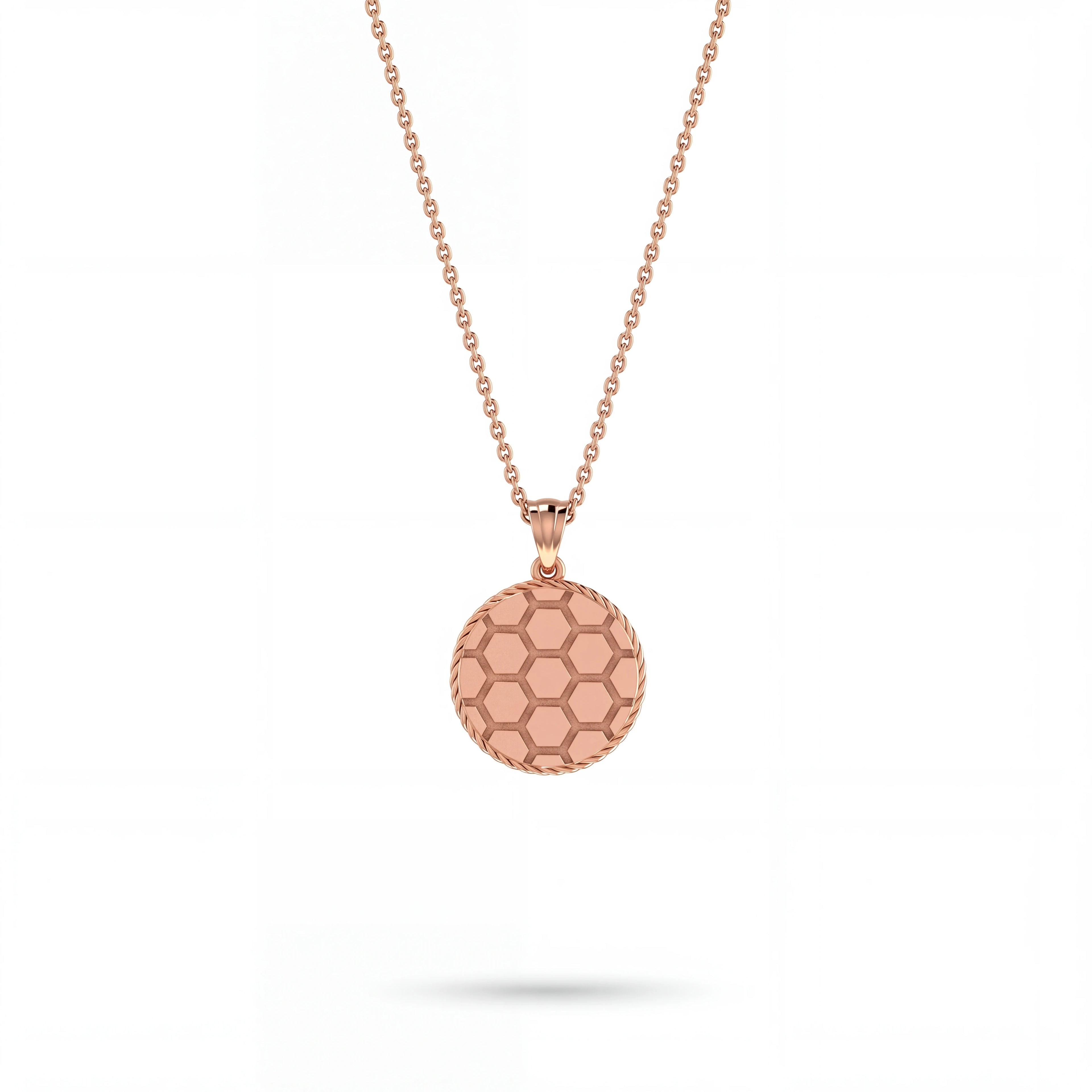 Honeycomb medallion pendant necklace in solid 14K gold, worn on the collarbone — Black Pearl of Queens