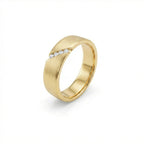Men’s diagonal diamond band in solid 14K yellow gold with brushed finish and angled channel set round diamonds