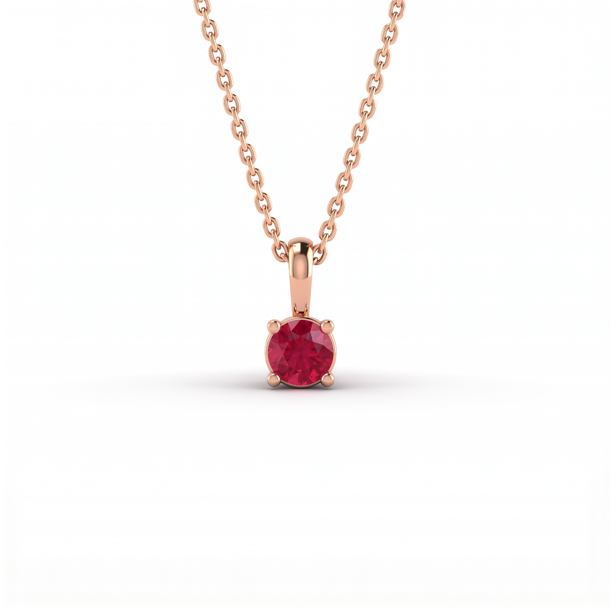 Lab-Created Ruby solitaire pendant in solid 14K rose gold, 5mm round stone in a four-prong setting on a cable chain