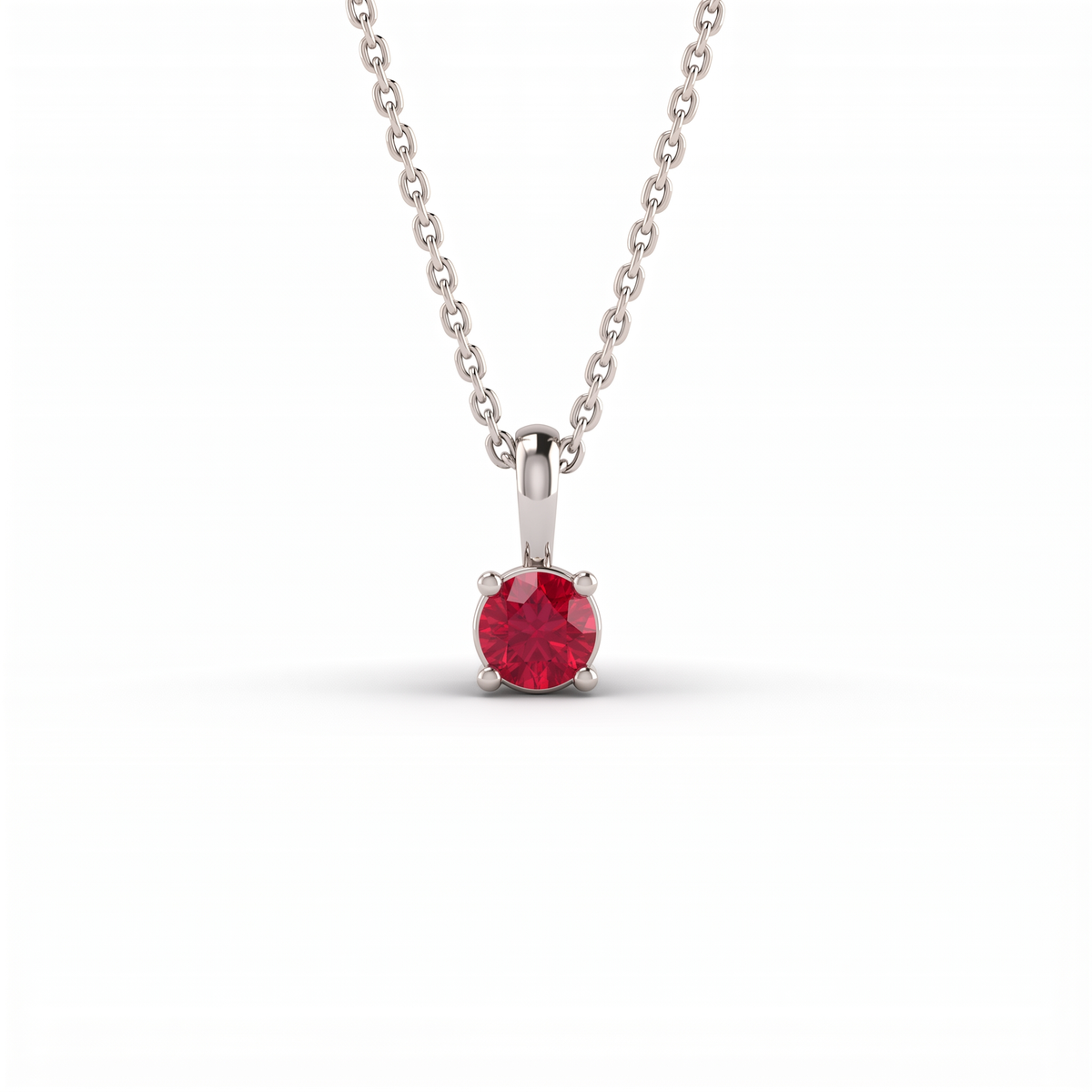 Lab-Created Ruby solitaire pendant in solid 14K white gold, 5mm round stone in a four-prong setting on a cable chain