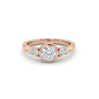 Lab-grown diamond bezel engagement ring in 14K rose gold with graduated accent diamonds