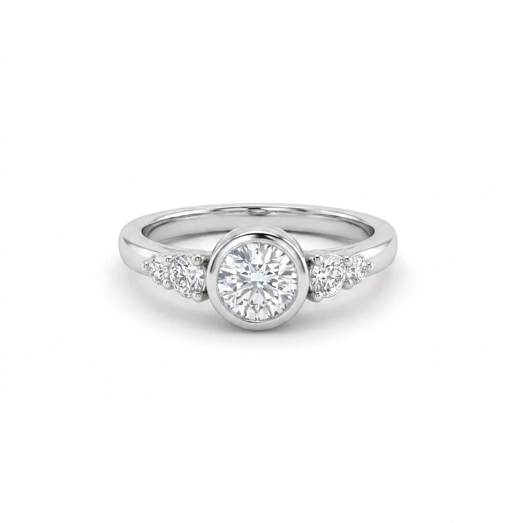 Lab-grown diamond bezel engagement ring in 14K white gold with graduated accent diamonds