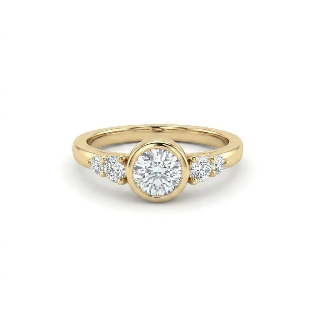 Lab-grown diamond bezel engagement ring in 14K yellow gold with graduated accent diamonds