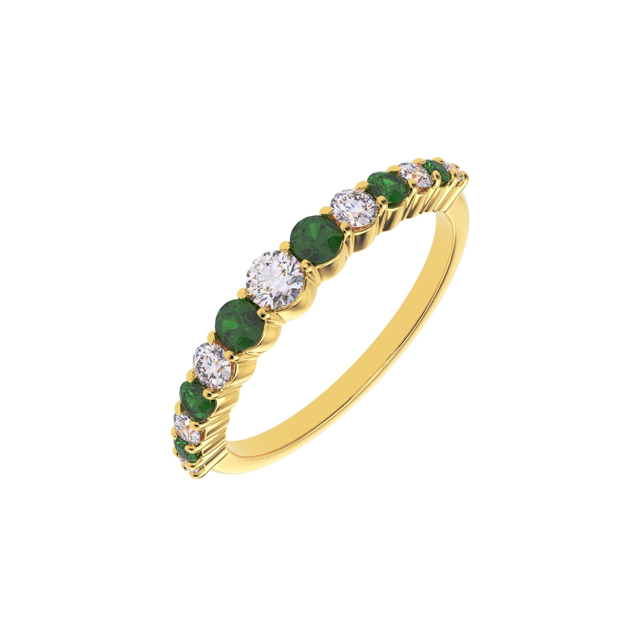 Side angle of emerald and graduated diamond half eternity wedding band in yellow gold
