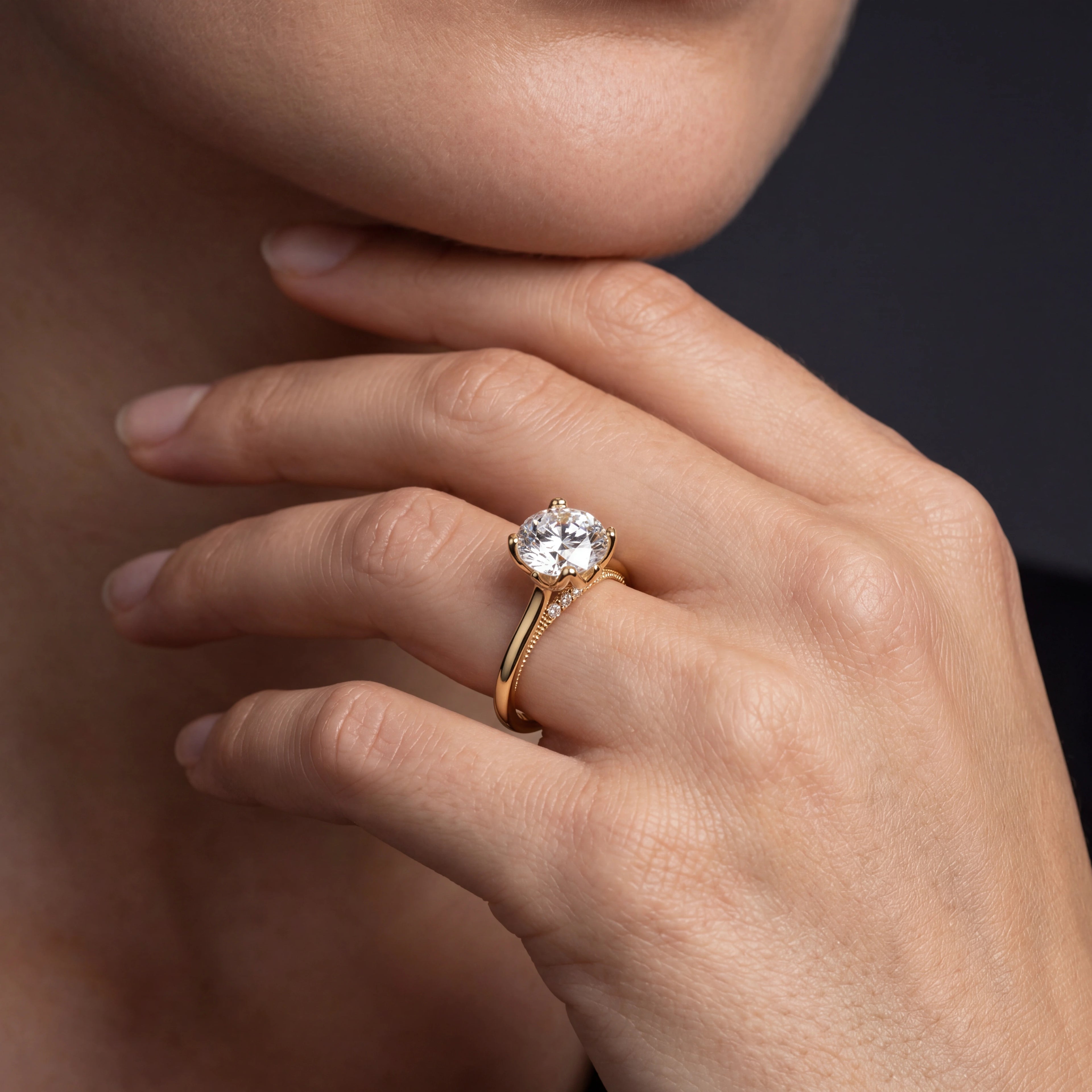 Model wearing lotus prong milgrain Lab-Grown Diamond engagement ring in 14K yellow gold, close-up showing petal prong setting and gallery detail — Black Pearl of Queens