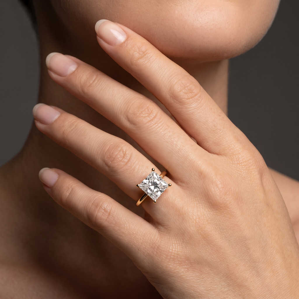 Hand wearing a princess cut Lab-Grown Diamond solitaire engagement ring in 14K white gold