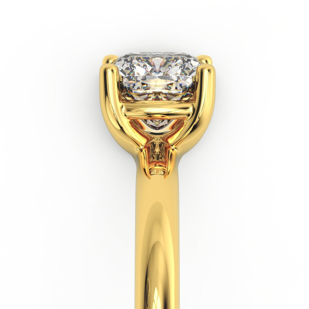 Side profile of Madison cushion solitaire engagement ring highlighting low-set cushion diamond and smooth gold band