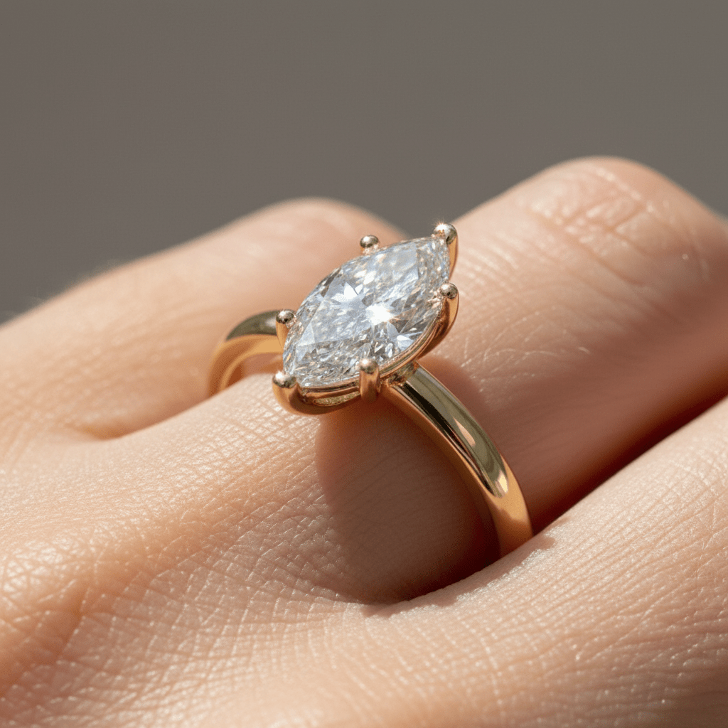 Macro close-up of a 1ct marquise engagement ring in 14K yellow gold showing natural sparkle and diamond detail.