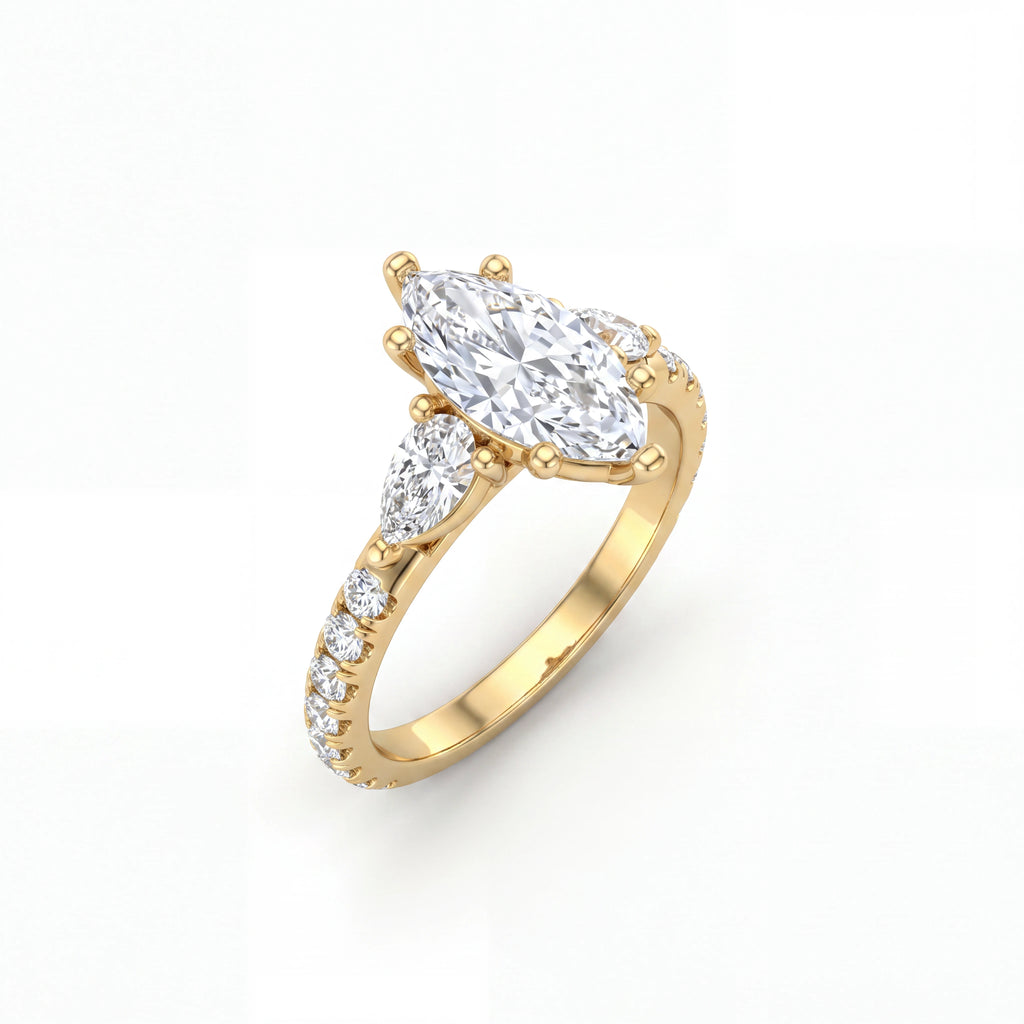 Marquise Lab-Grown Diamond three-stone engagement ring with pear side stones in 14K yellow gold, angled view — Black Pearl of Queens